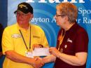 DARA President Don Dubon, N6JRL, presented two $10,000 checks to ARRL President Kay Craigie, N3KN, today at Dayton Hamvention. [Steve Ford, WB8IMY, photo] 